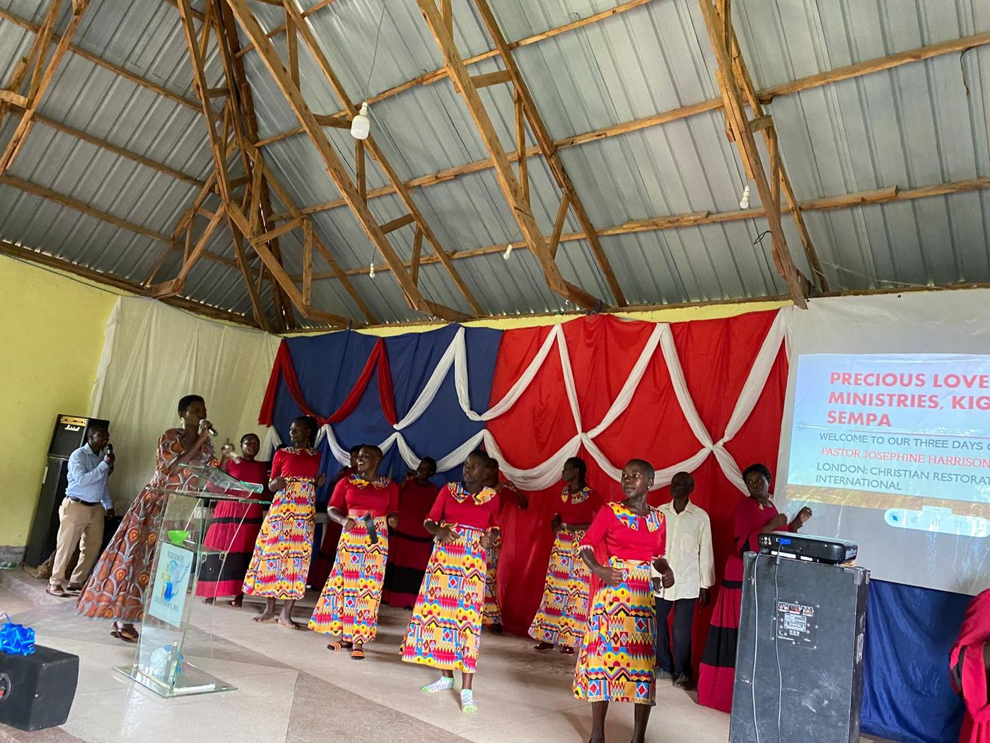 A choir singing at the front of a partner church during a CRMI mission service